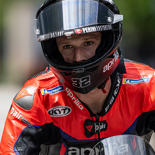 Lorenzo Savadori at Motogp looking just beyond the camera in his KYT KX-1 Race GP Motorcycle Helmet