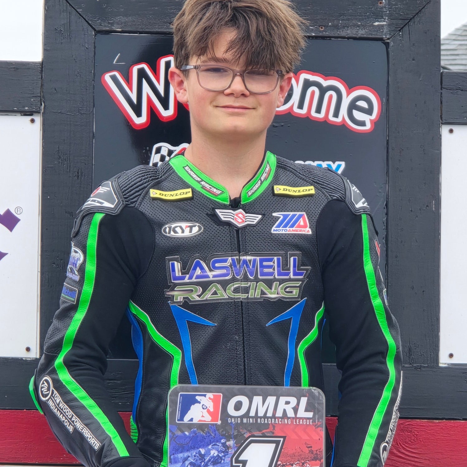 Aiden Laswell holding his 2025 OMRL GP1 Champion plaque