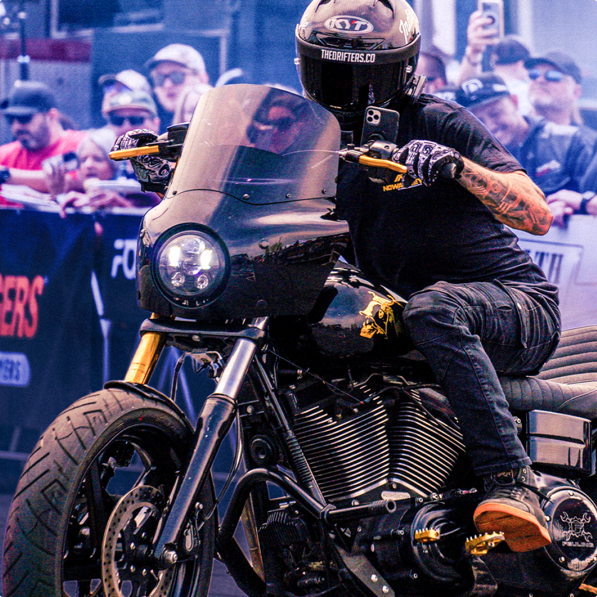 Drifters Collective Nowaskey performance harley davidson rider doing a stunt show in a Carbon fiber NZ-Race