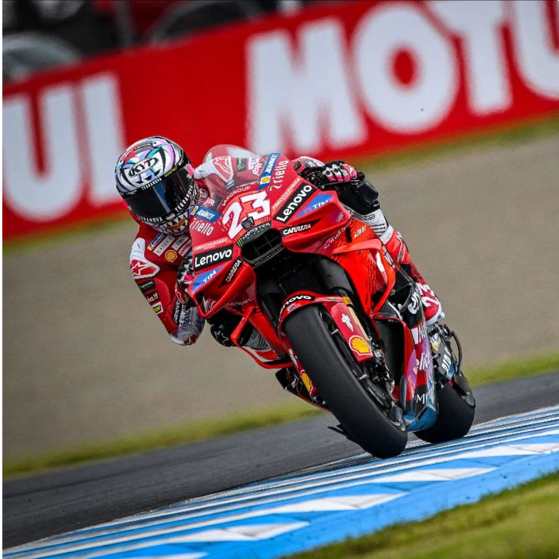 KYT rider Enea Bastianini on his red Ducati in MotoGP, wearing a custom KX-1 Race GP